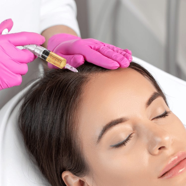 A patient receiving PRP hair restoration at Revival Health & Wellness