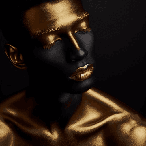 Portrait with gold body paint behind the homepage consultation form