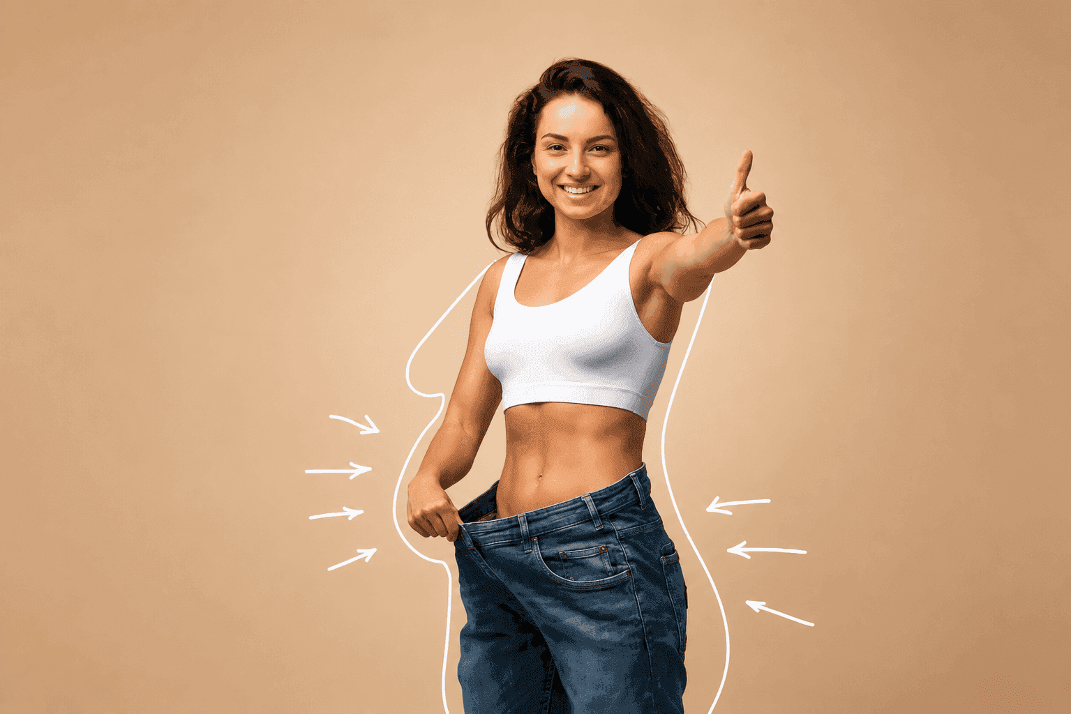 Smiling woman celebrating weight-loss results, giving a thumbs up in jeans that are now too big